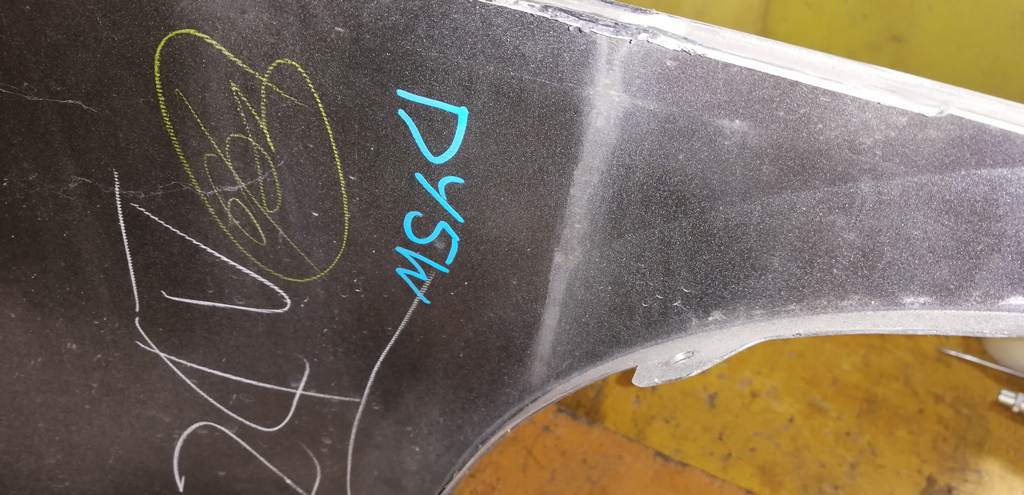 бампер Mazda Demio 9