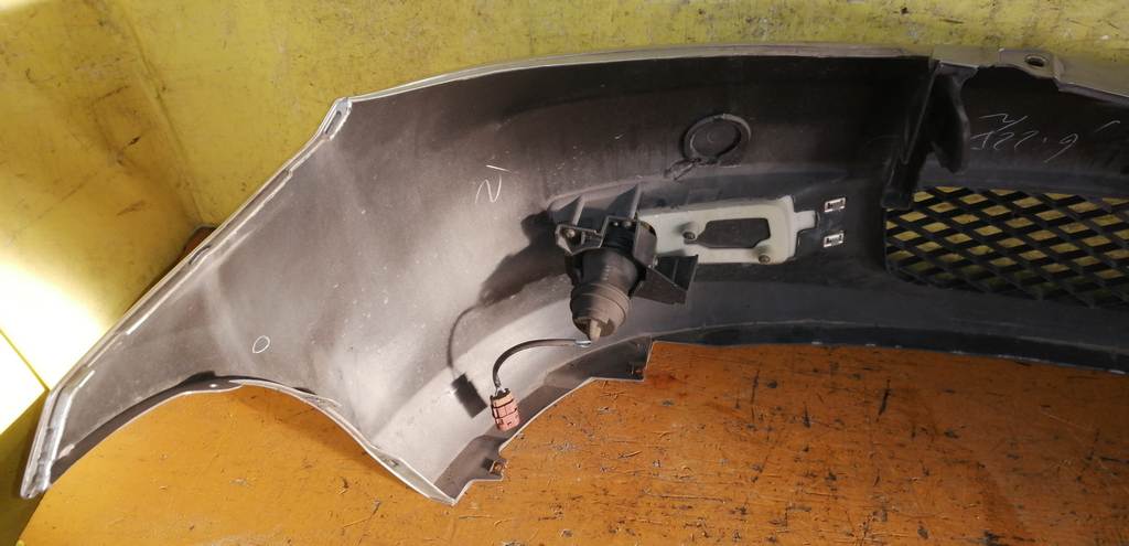 бампер Mazda Demio 12