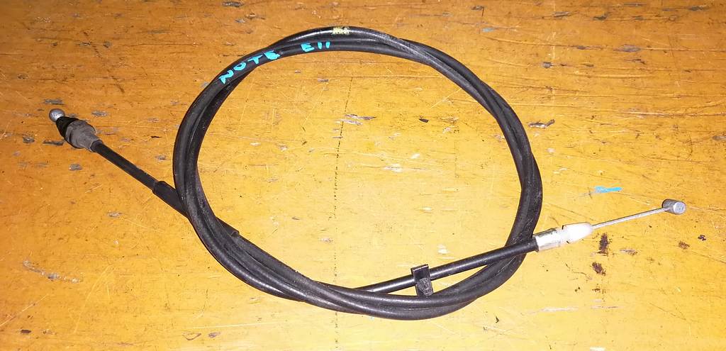 трос капота Nissan Note 0