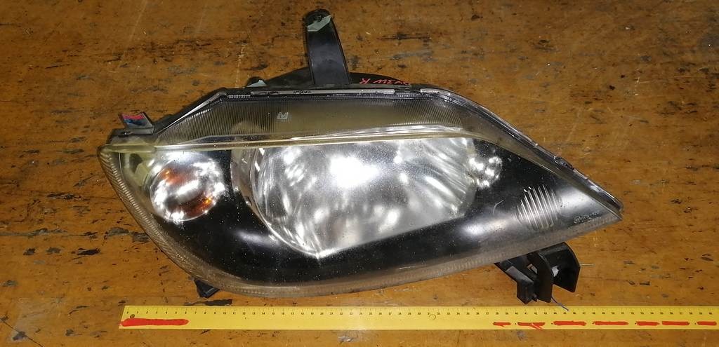 фара Mazda Demio 0