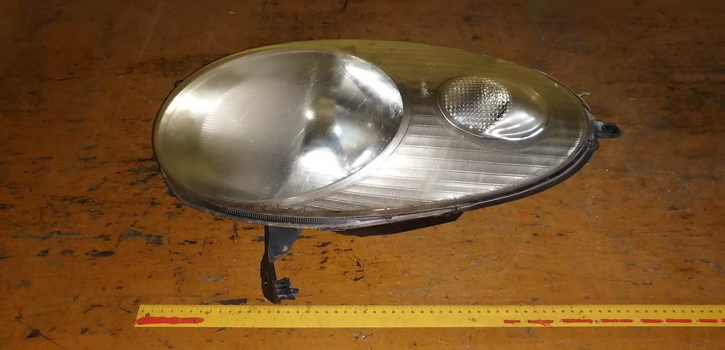 фара Nissan March 0