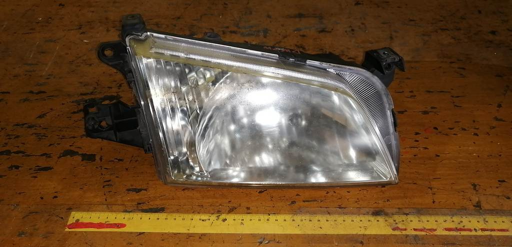 фара Mazda Demio 0